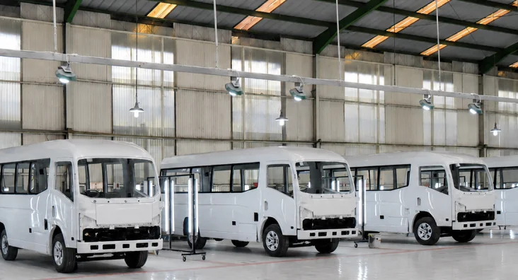 Minibus bodies in primer at the New Armada bodyworks line
