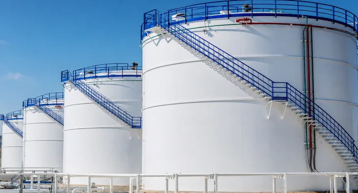 White storage tanks at an oil refinery